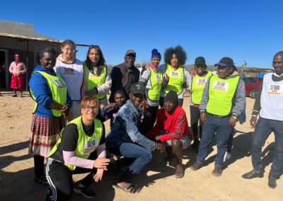Staff-members-and-community-members-posing-for-a-photo