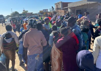 Wide-angle-shot-of-the-community-queueing-for-food